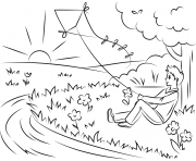 Printable boy flying kite at sunset coloring pages